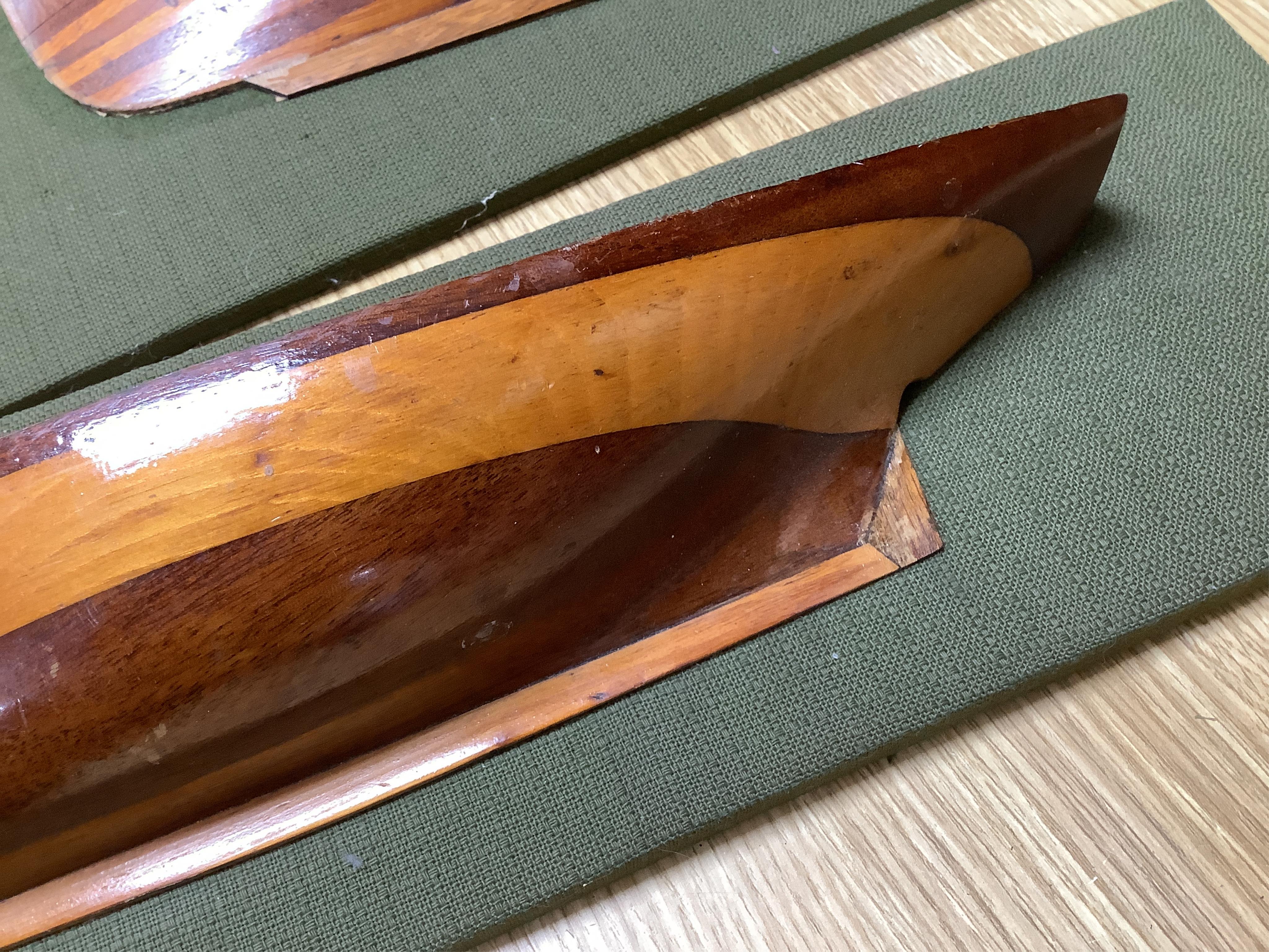 Two mounted cross banded mahogany and yew wood split hull models. Condition - fair to good